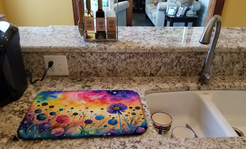 Floral dish drying mat laid on kitchen sink countertop