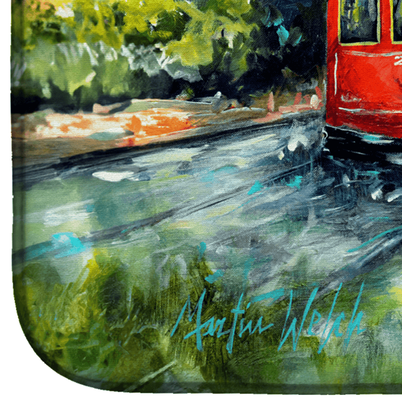 Dish drying mat corner close-up with red street car on painted roadway scene