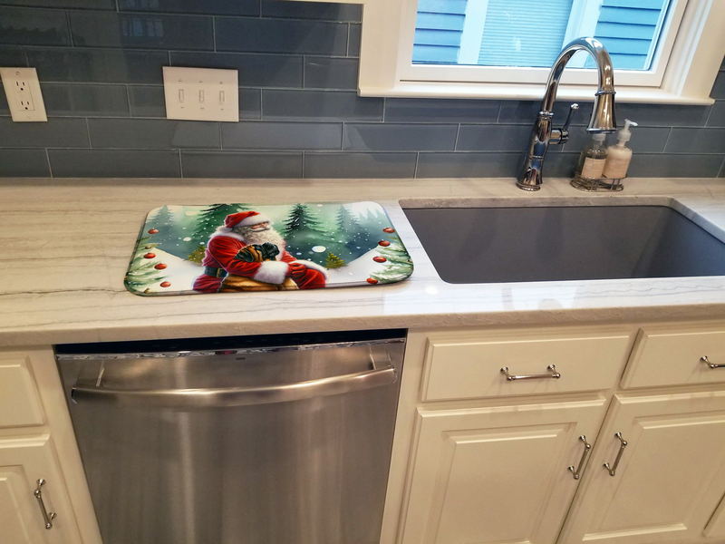 Santa-themed dish drying mat on countertop beside a kitchen sink