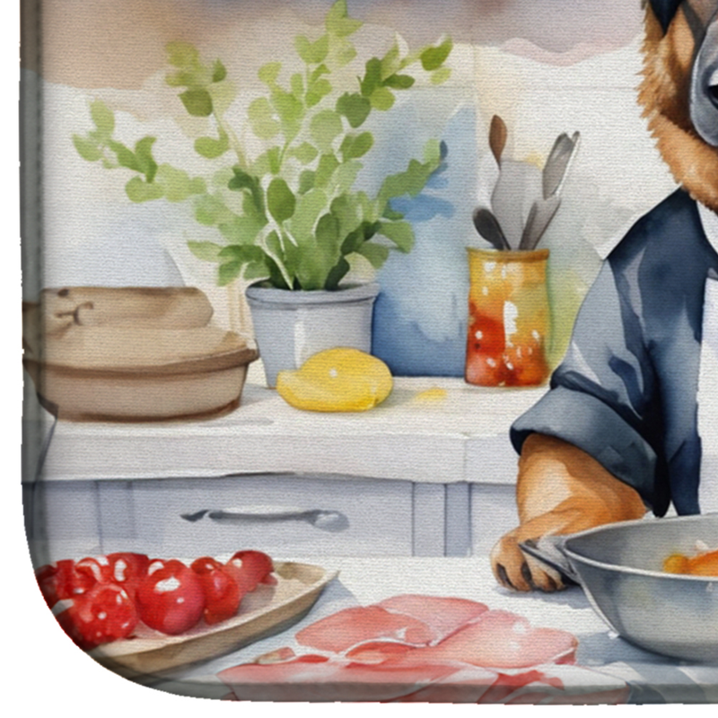 Close-up corner of dish drying mat with chef dog scene and kitchen ingredients