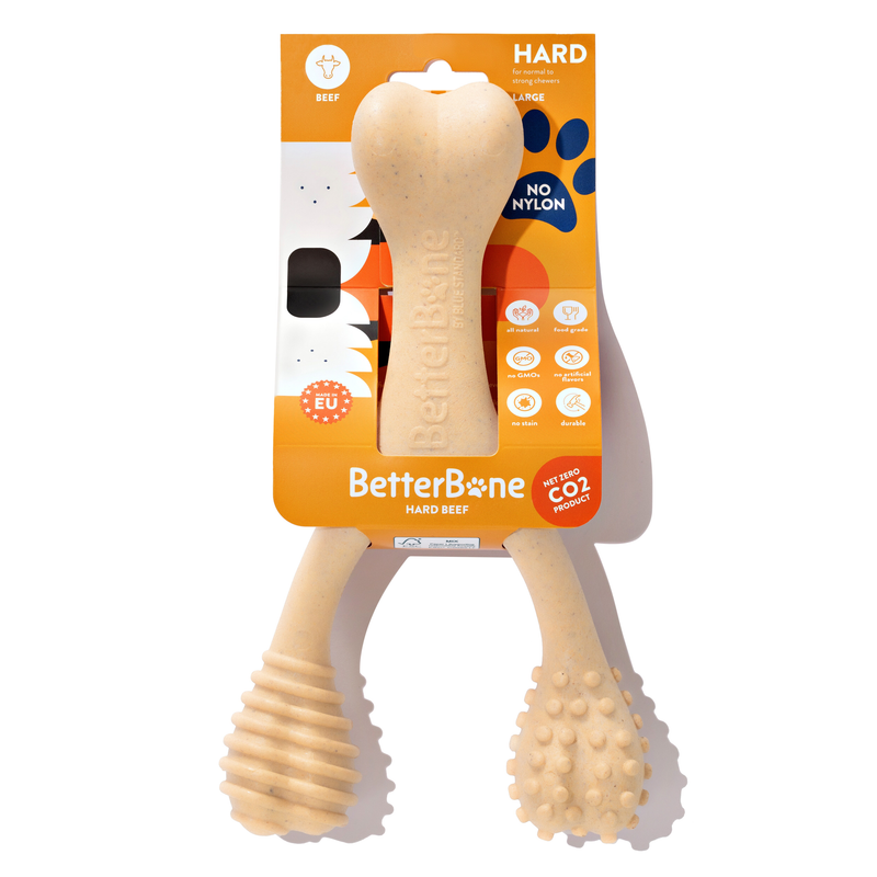Hard beef bone-shaped dog chew toy with ribbed handle and knobbly end pads
