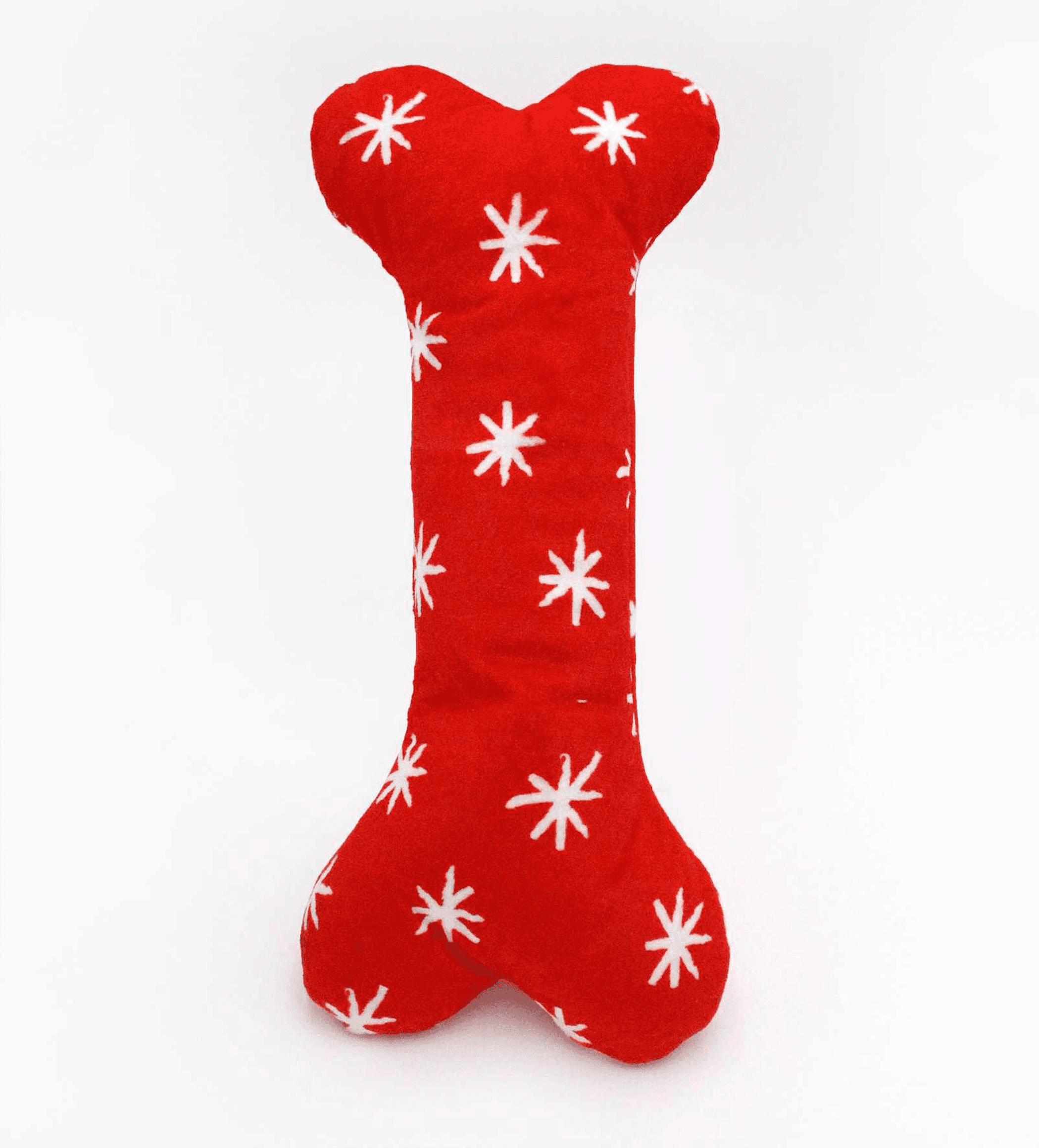 Red festive bone plush dog toy with white snowflake pattern