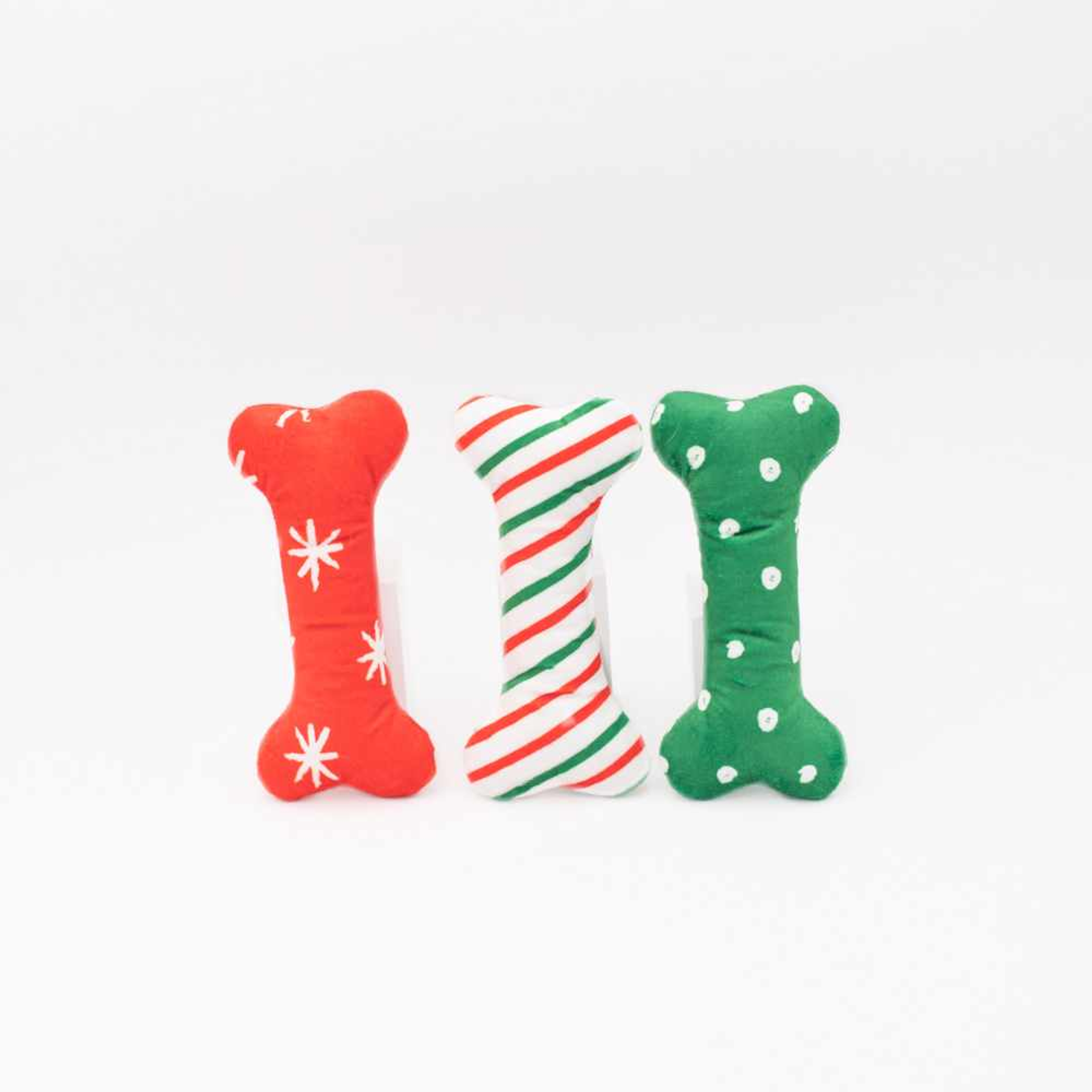 3-pack plush dog bone toys: red snowflake, striped candy cane, green with spots