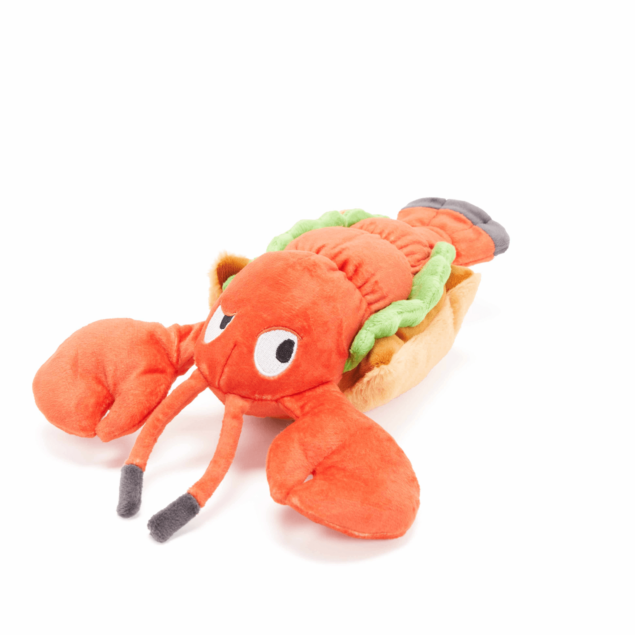 Plush lobster roll dog toy with orange crustacean and green garnish