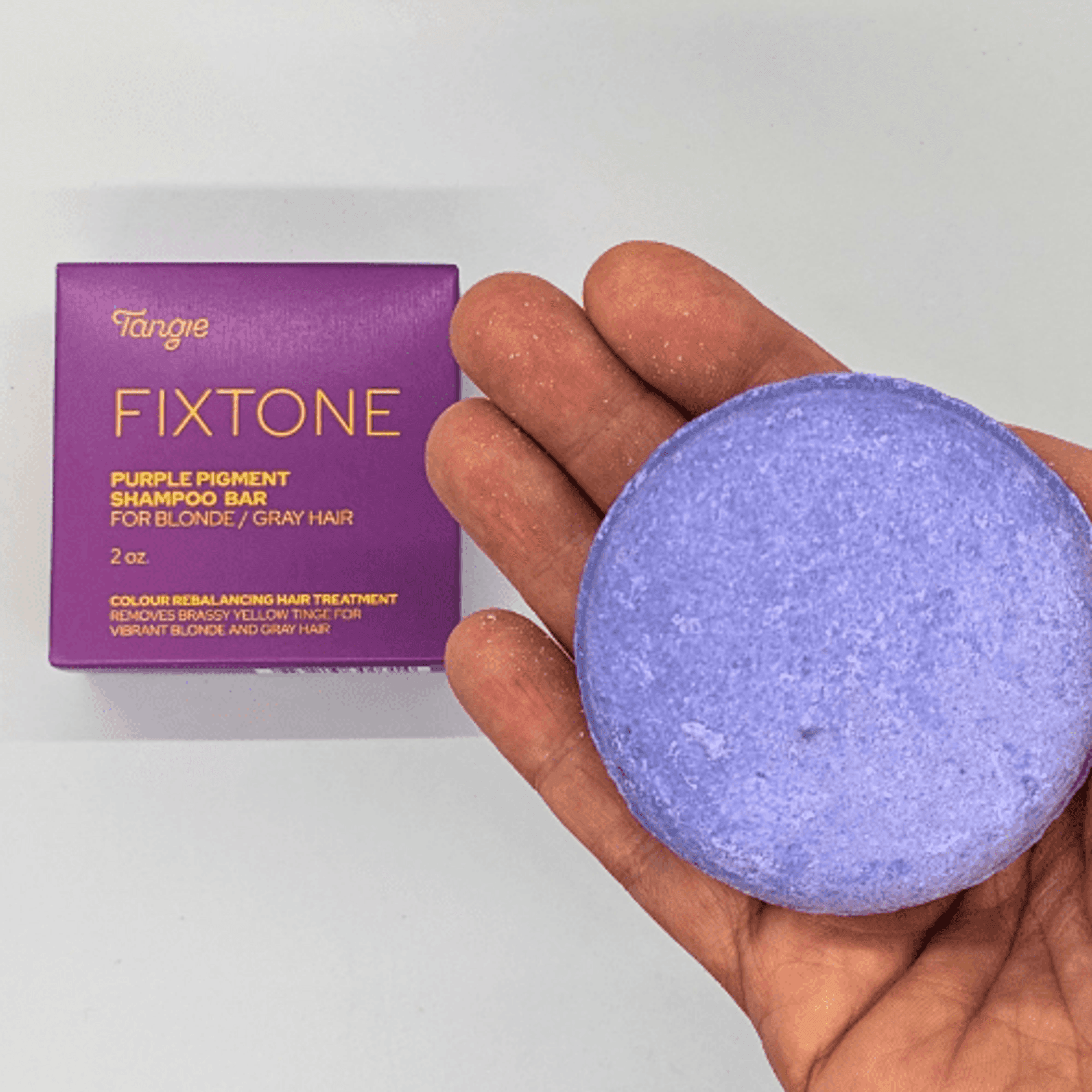 Purple shampoo bar pigment for blonde/gray hair, with purple round bar and box