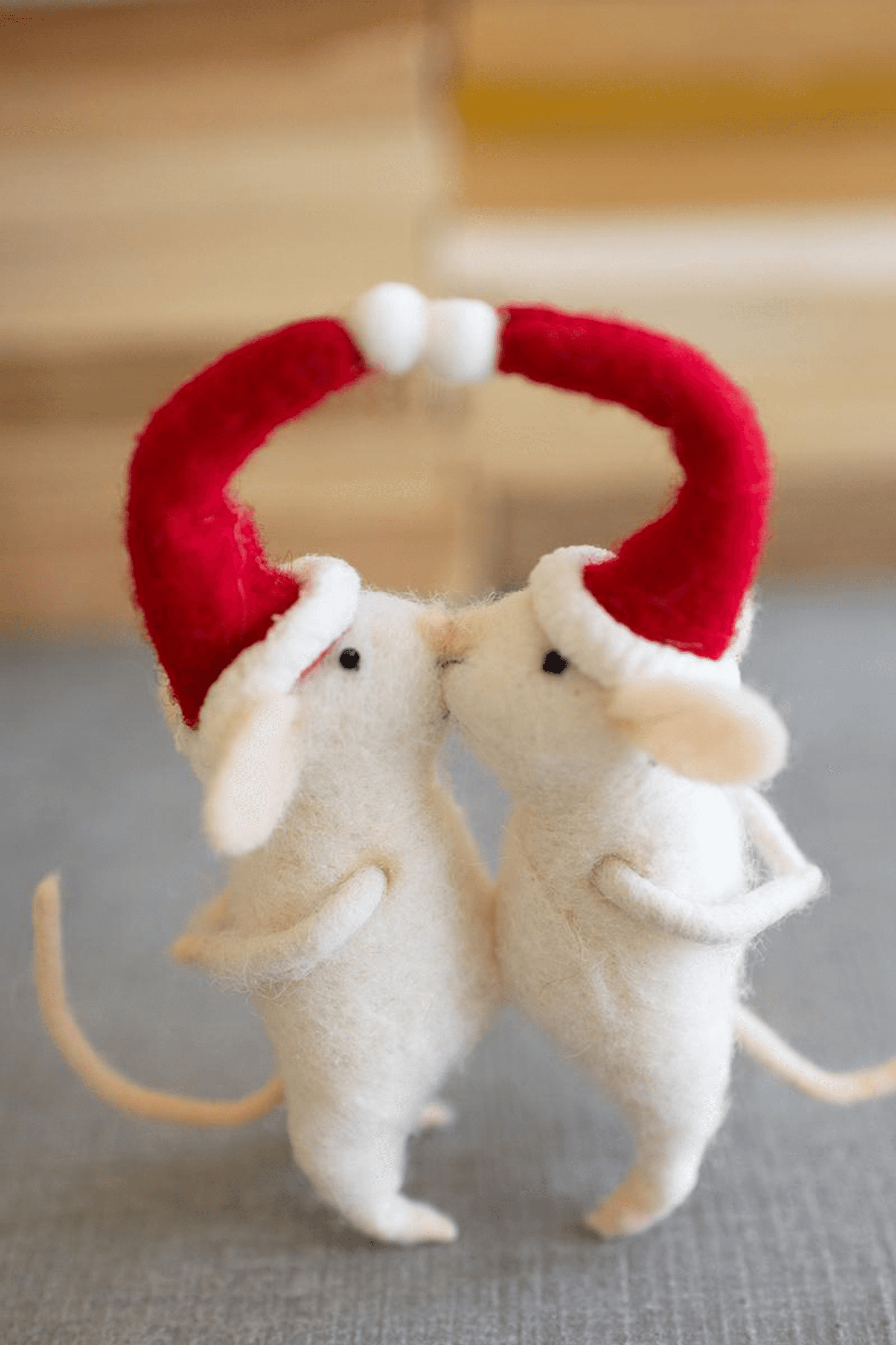 Kissing felt Christmas mice, cream bodies, red felt wreath arms, white bead accents