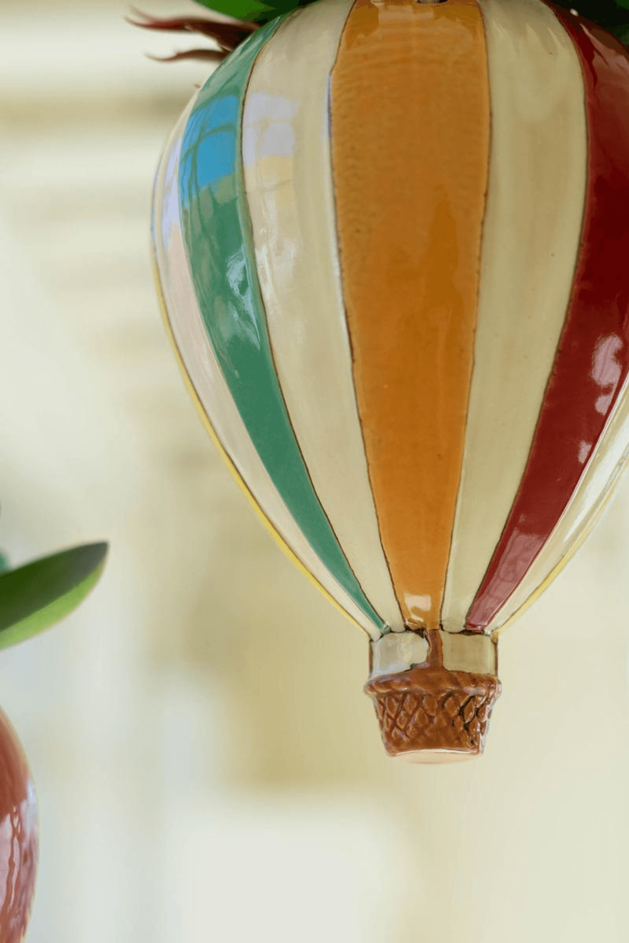 Ceramic hot air balloon planter with multicolor stripes and hanging rope