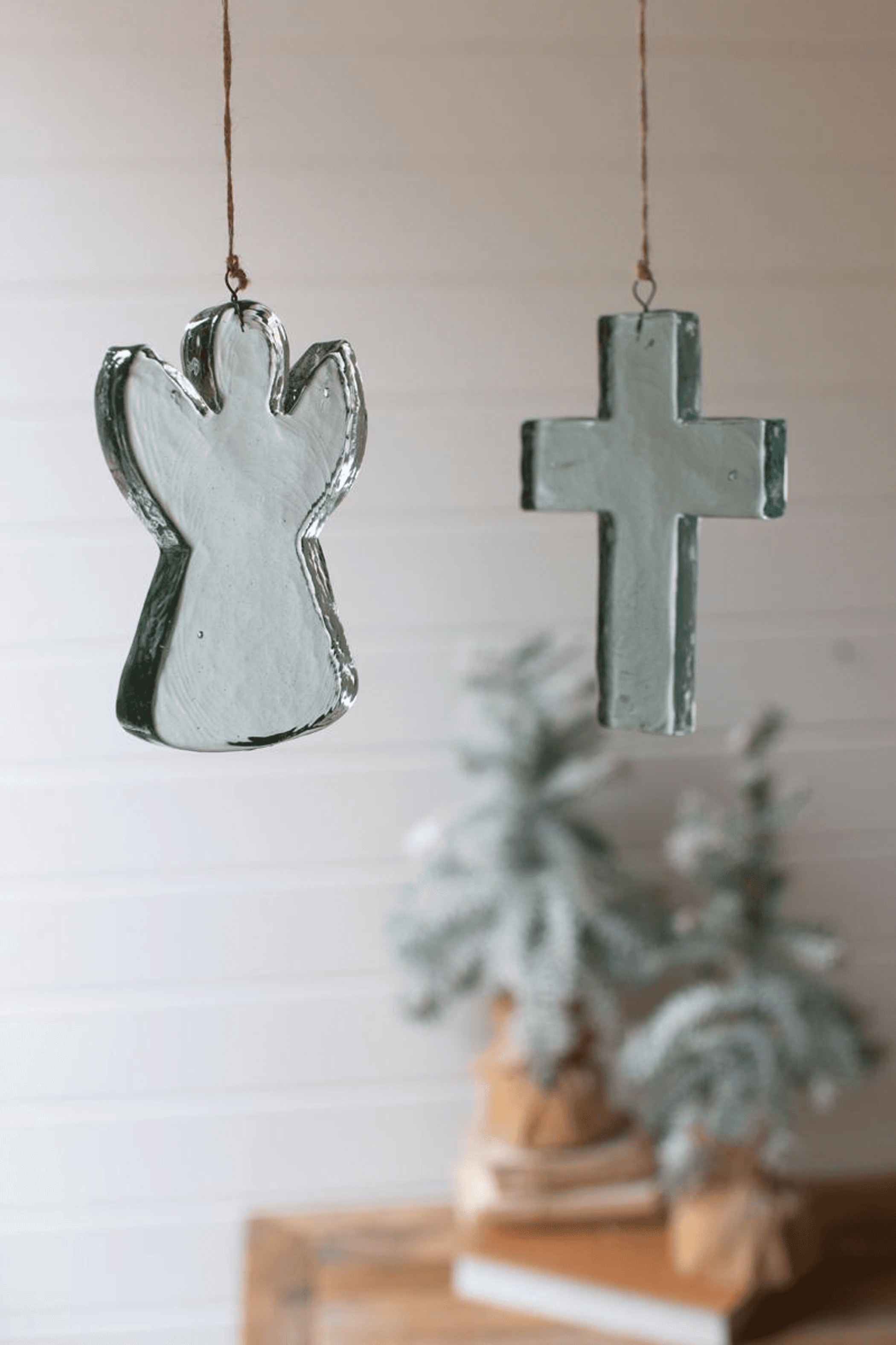 Blue glass angel Christmas ornament hanging with metal loop, arched wings design