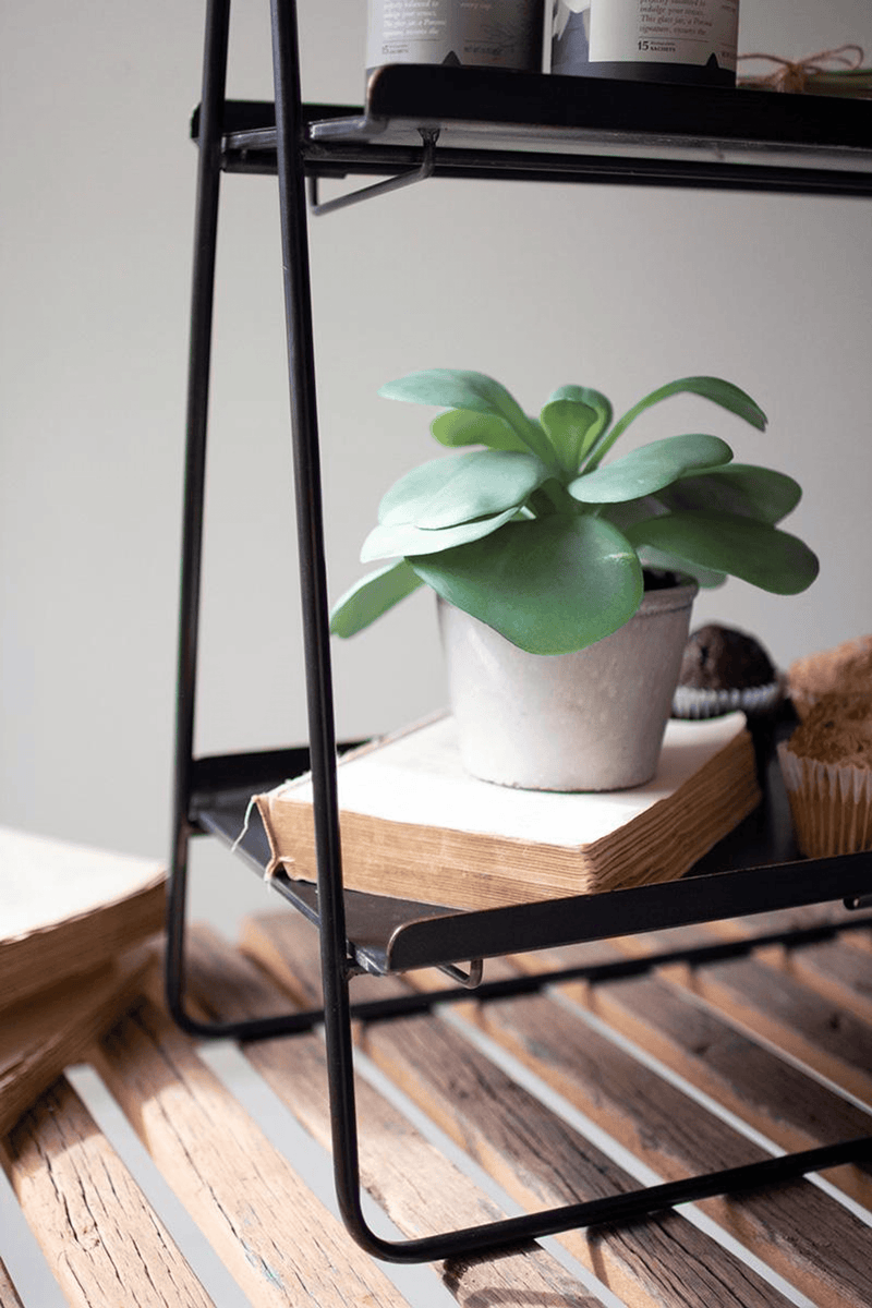 Black two-tier rectangle display rack, angled view of steel frame and shelves.