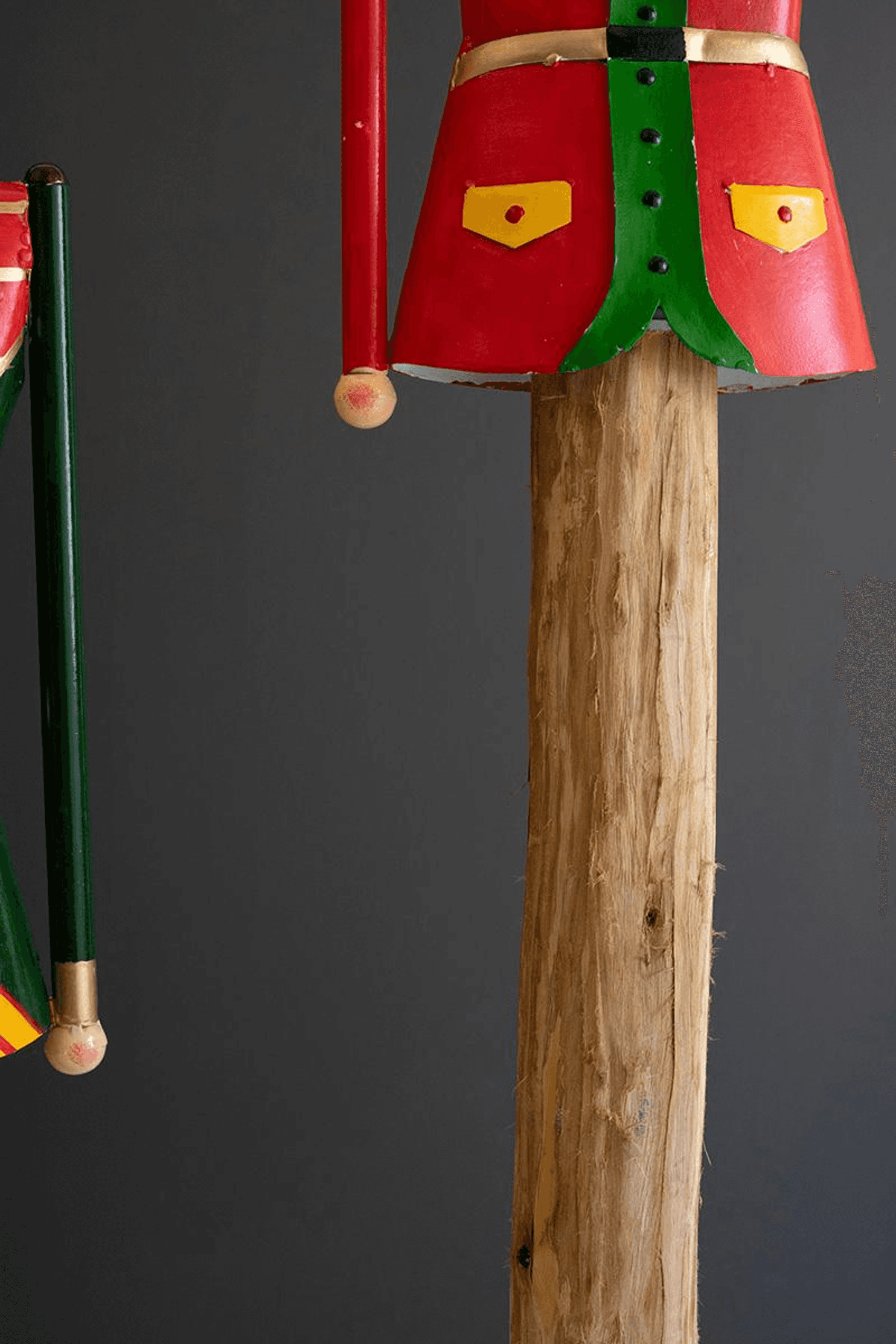 Painted nutcracker set of two: red and green coat over carved wooden body