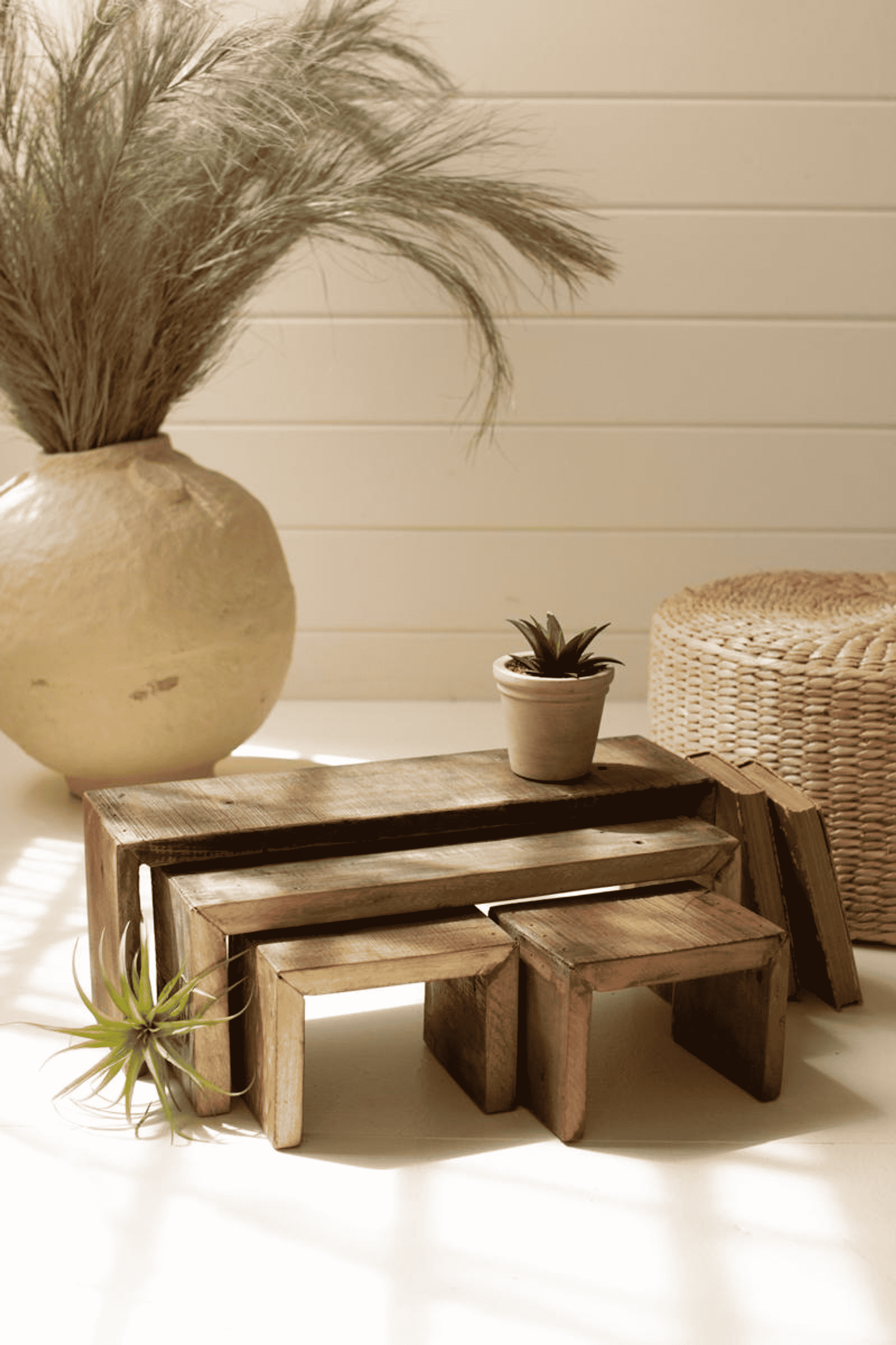 Brown recycled wood nesting rectangle risers, four-piece stack with top platform