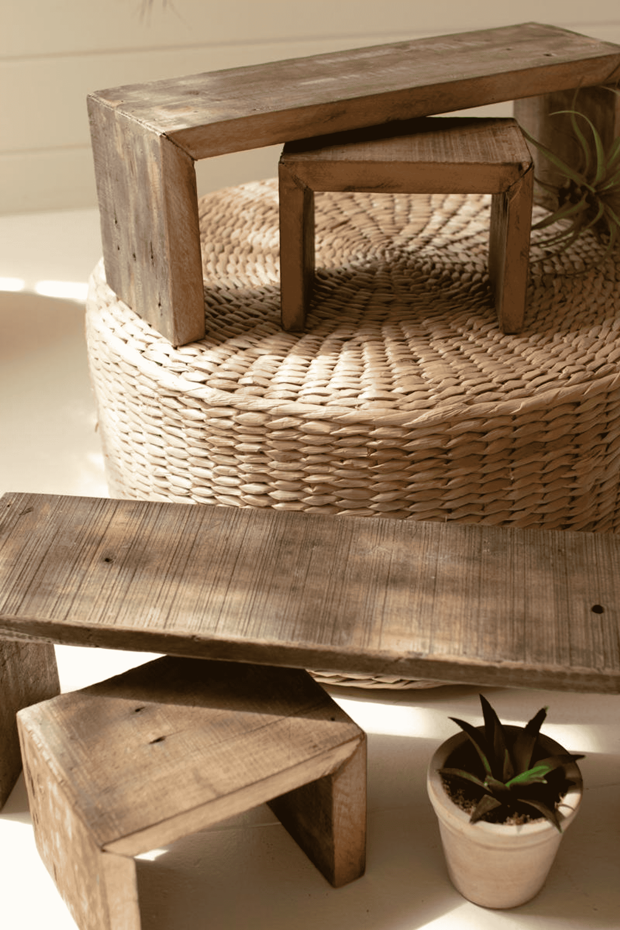 Stack of brown recycled wood nesting rectangle risers with open frames