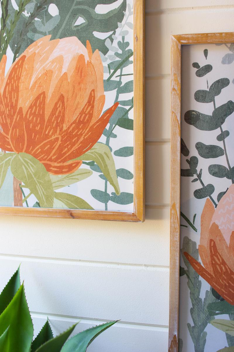 Under-glass framed botanical print with orange protea bloom and green leaf pattern, square