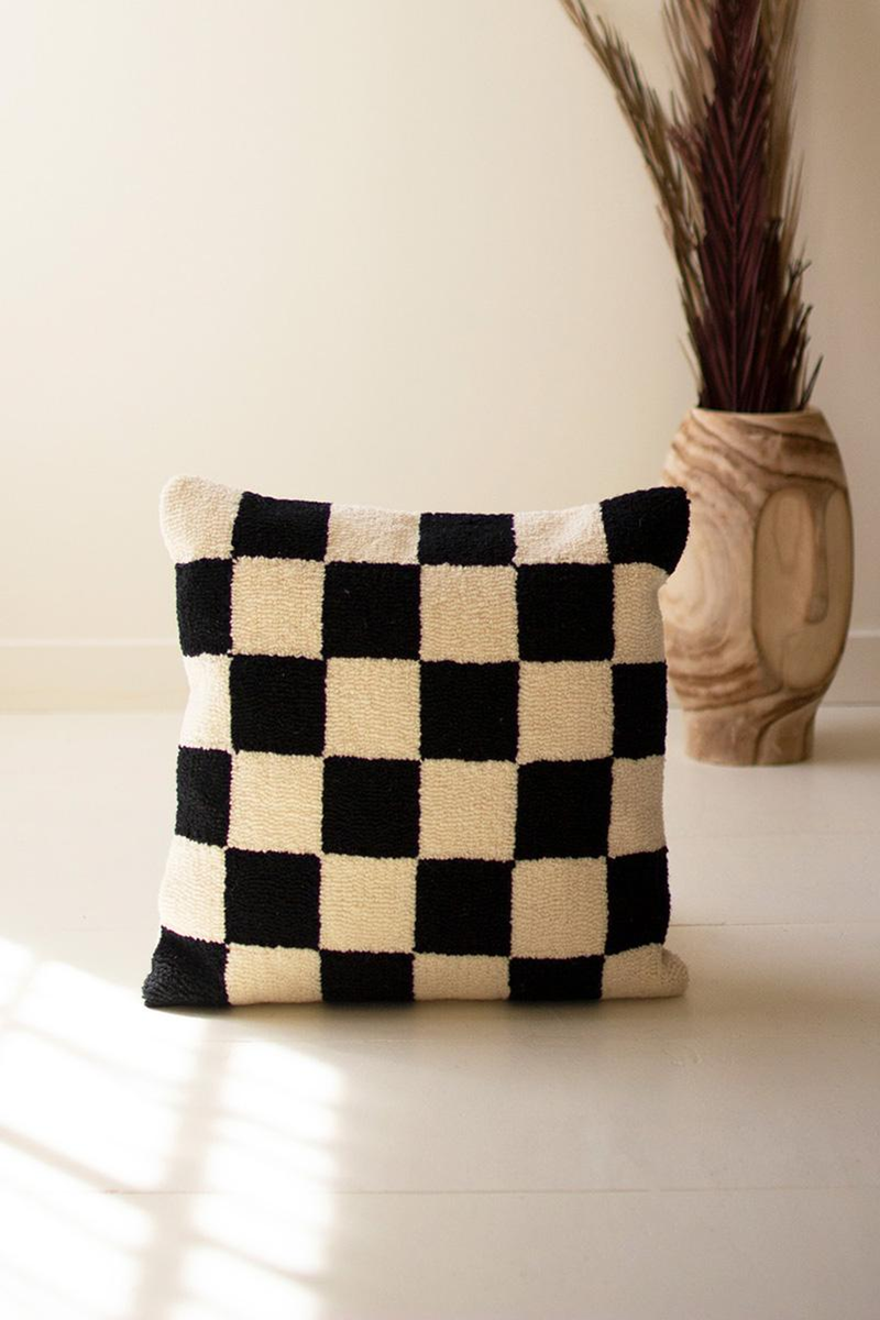 Black and white check hand-hooked pillow with square pattern and thick stitched edges