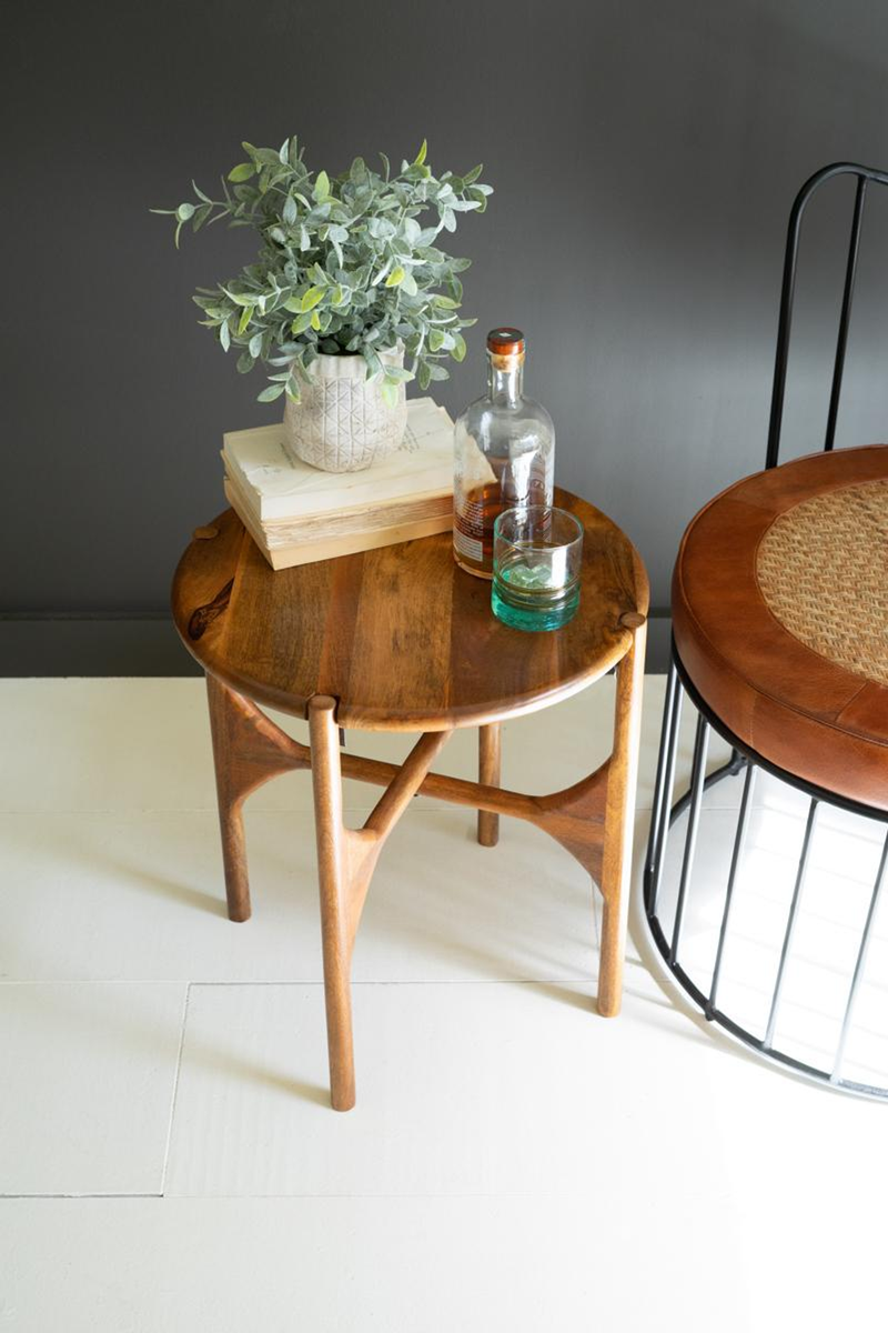 Round mango wood accent table with round tabletop and tapered wooden legs