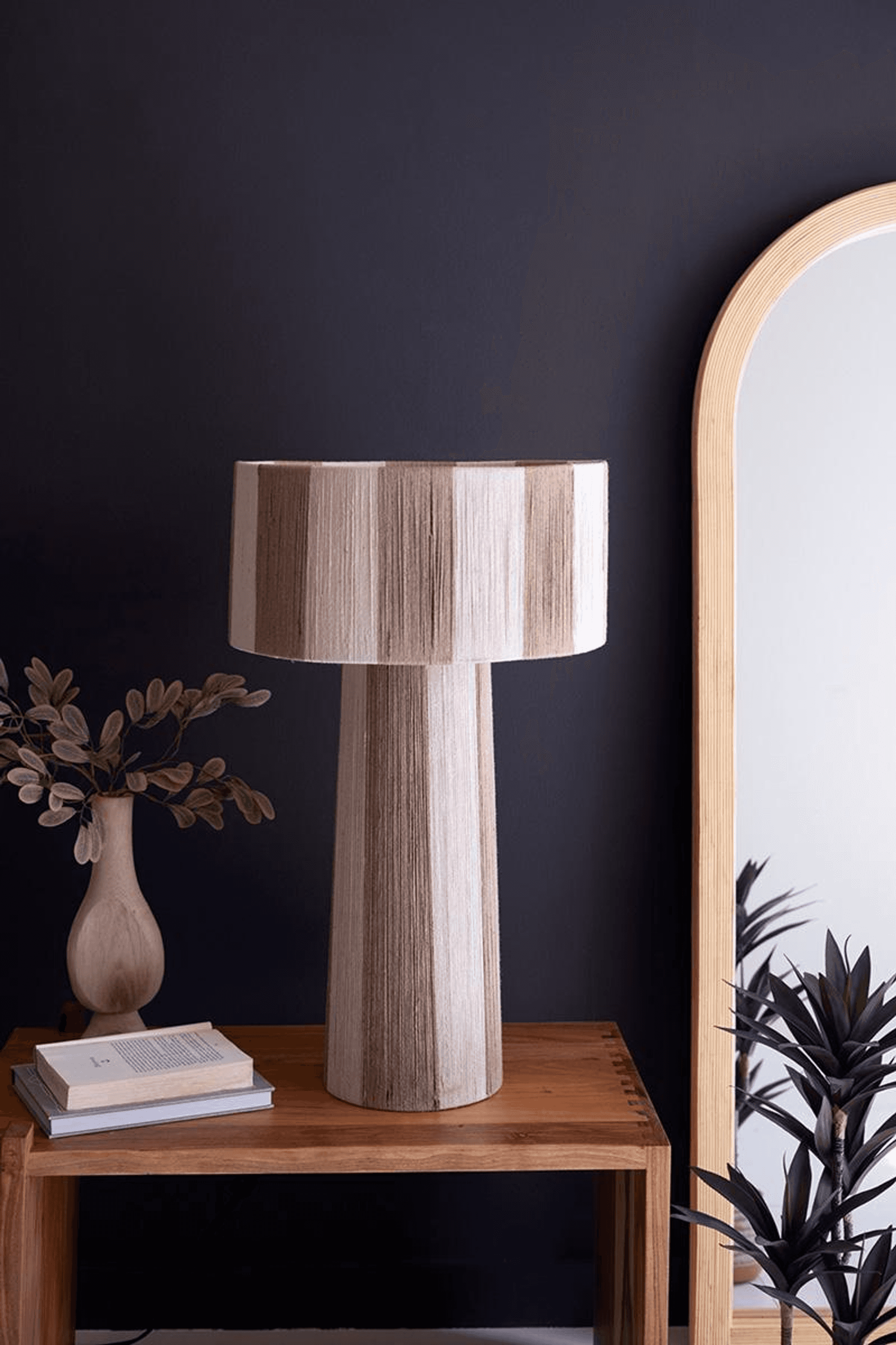 Natural jute table lamp with cylindrical pleated shade on wooden base