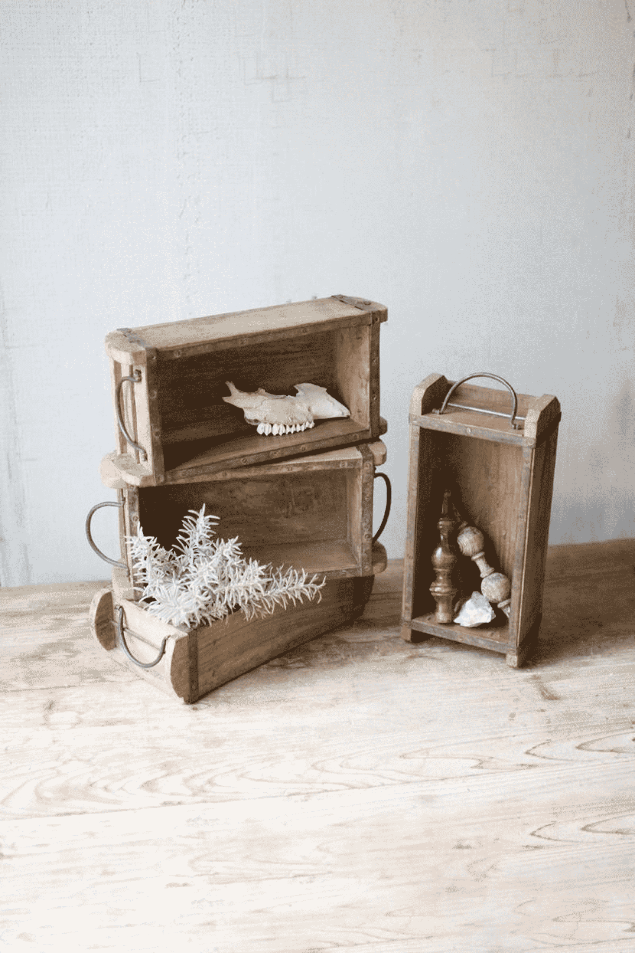 Wooden brick mold with iron handles, open cabinet style with compartment trays.