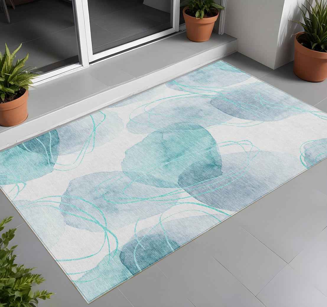 2' X 3' Teal and Ivory Abstract Washable Non Skid Indoor Outdoor Area Rug