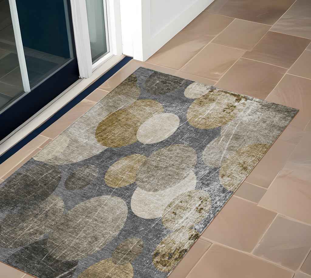 2' X 3' Brown Beige and Ivory Abstract Washable Non Skid Indoor Outdoor Area Rug