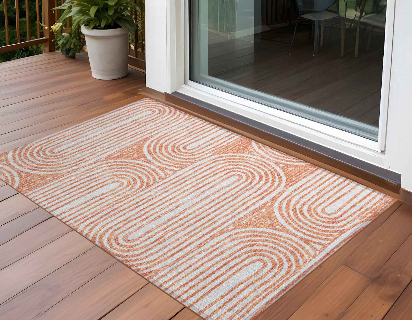 3' X 5' Orange and Ivory Abstract Washable Non Skid Indoor Outdoor Area Rug
