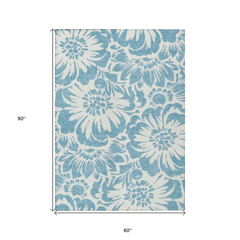 5' X 8' Denim and Ivory Floral Washable Non Skid Indoor Outdoor Area Rug