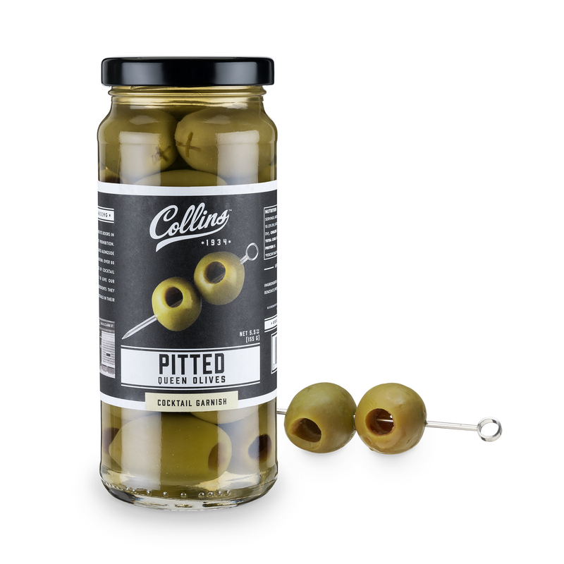 Jar of pitted green olives with metal olive pick and olives