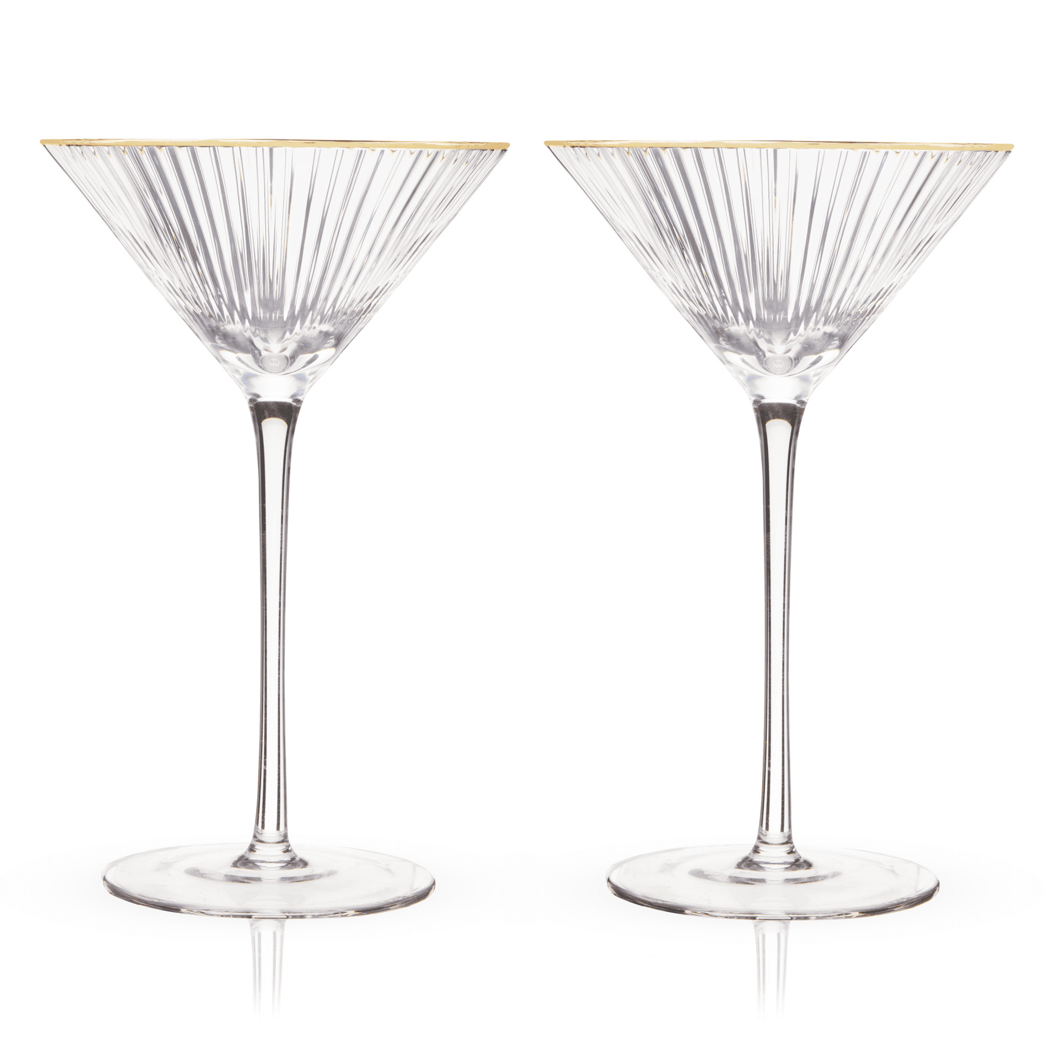 Two clear ribbed martini glasses with gold-dipped rims and round glass bases