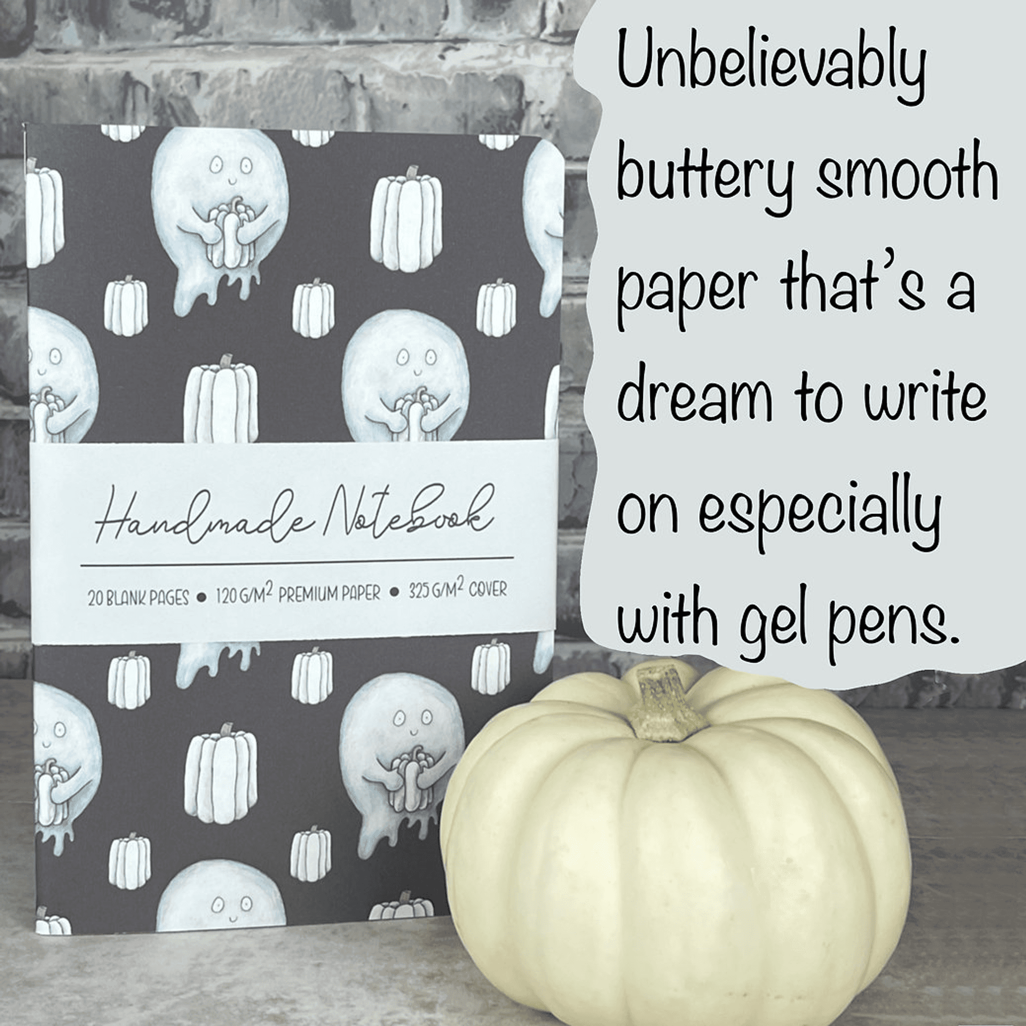 Handmade notebook with dark cover and light blue ghost & pumpkin pattern, staple bound