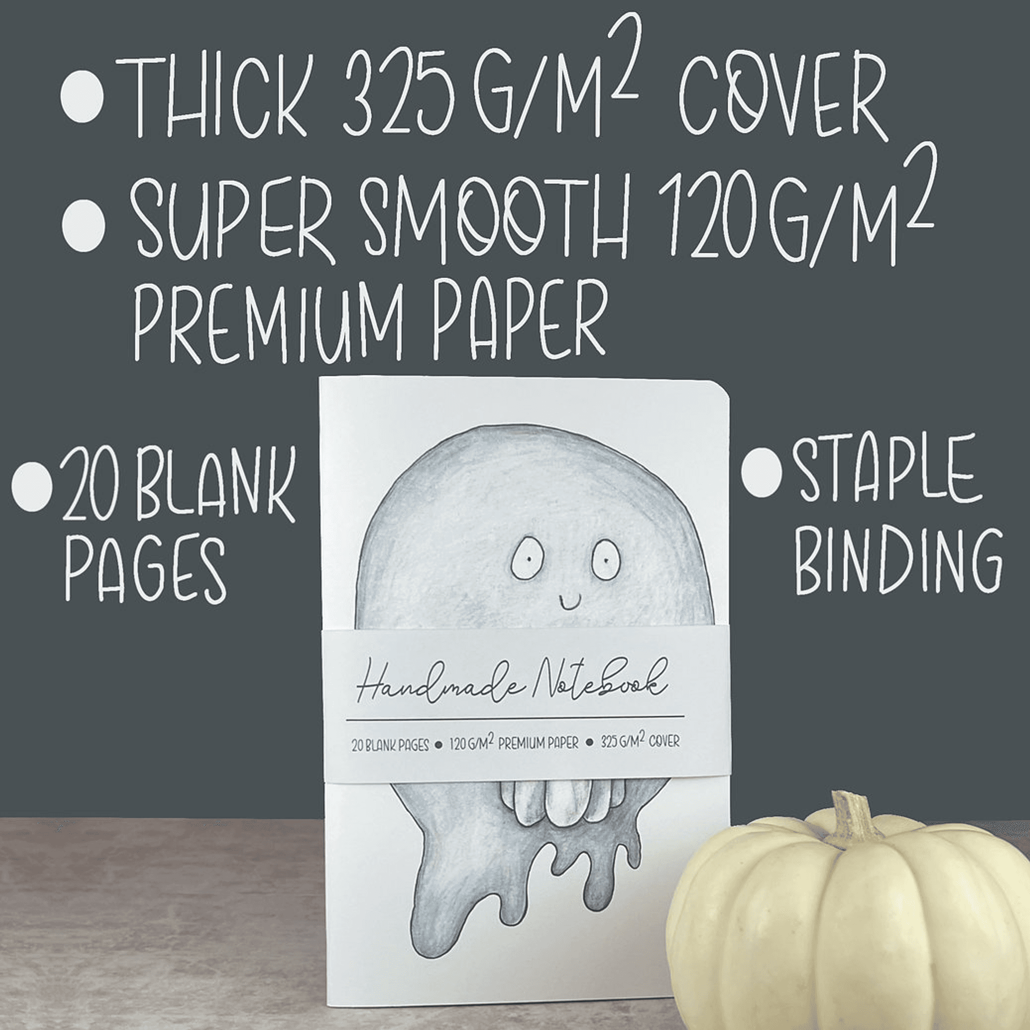 Handmade pumpkin ghost notebook with light blue cover art and staple binding, blank pages