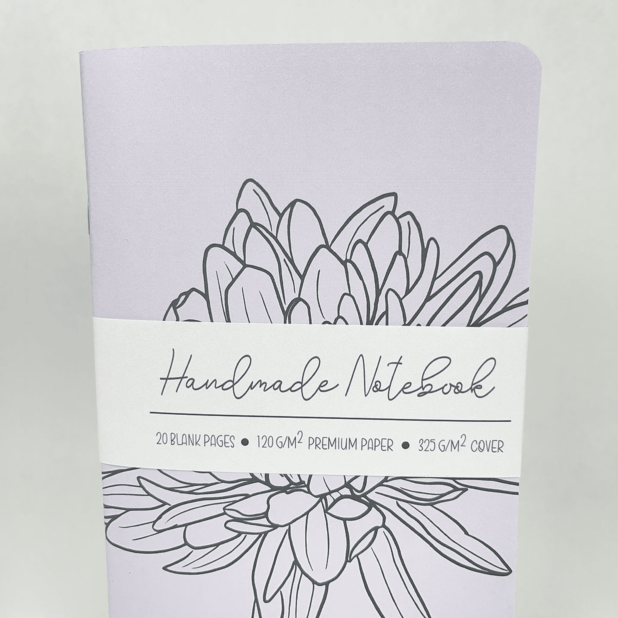 Lilac handmade notebook with hand-drawn flower illustration and “Handmade Notebook” title