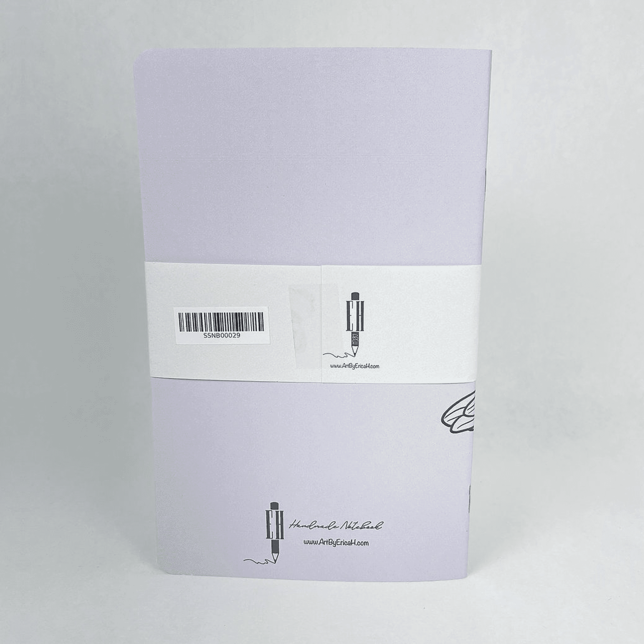 Lilac notebook back cover with barcode label and small logo