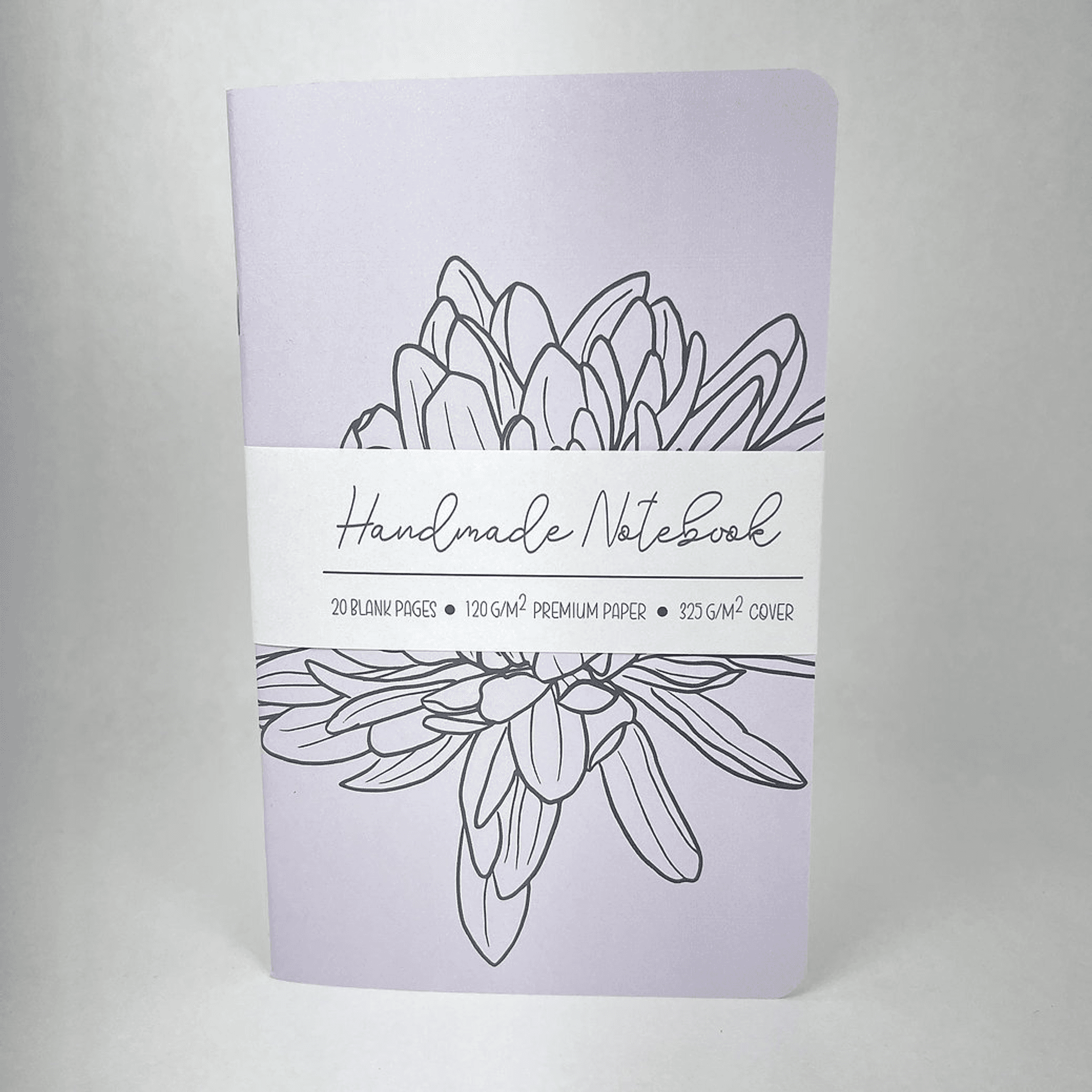 Lilac notebook front cover with hand-drawn flowers and “Handmade Notebook” text