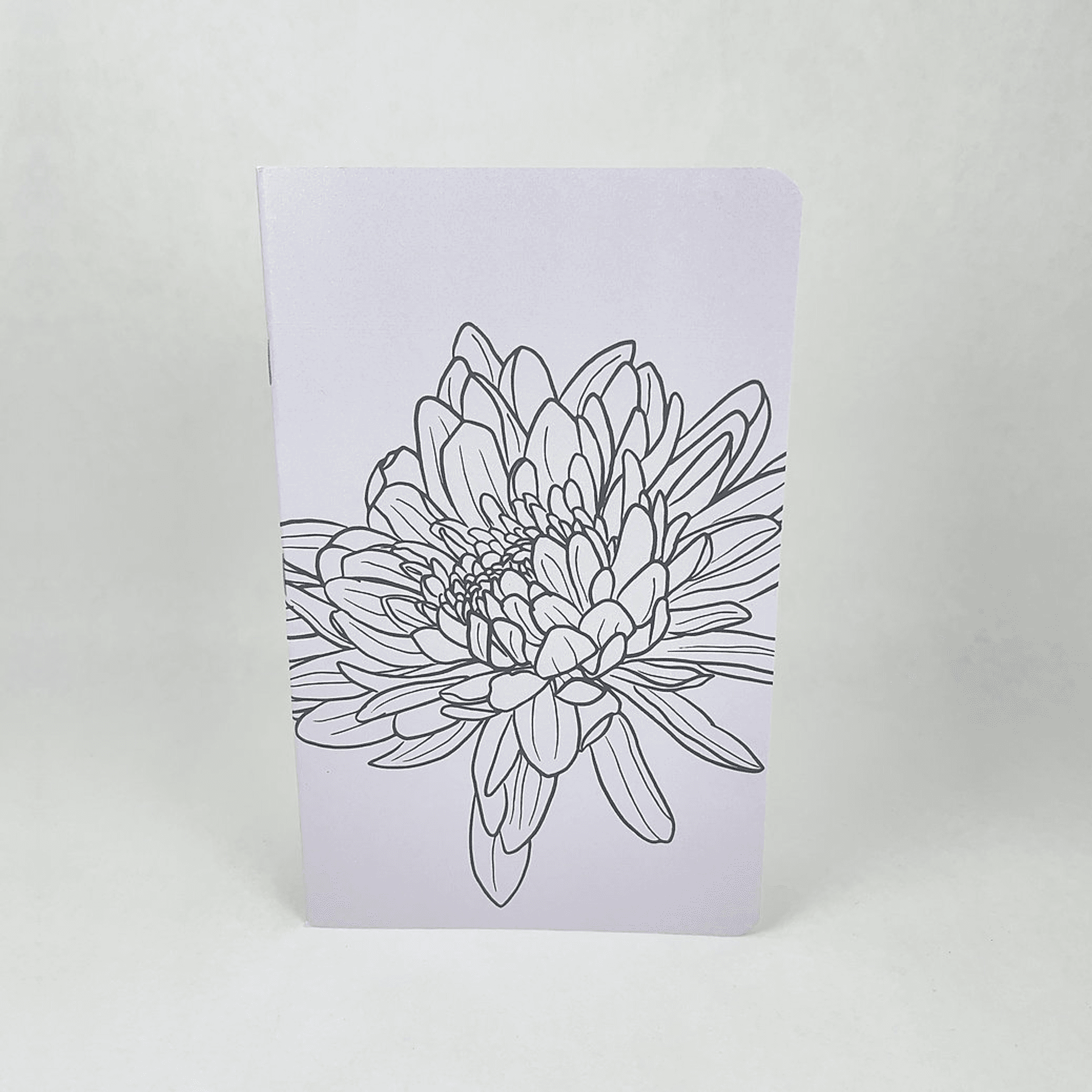 Lilac notebook with hand-drawn flower illustration on the front cover
