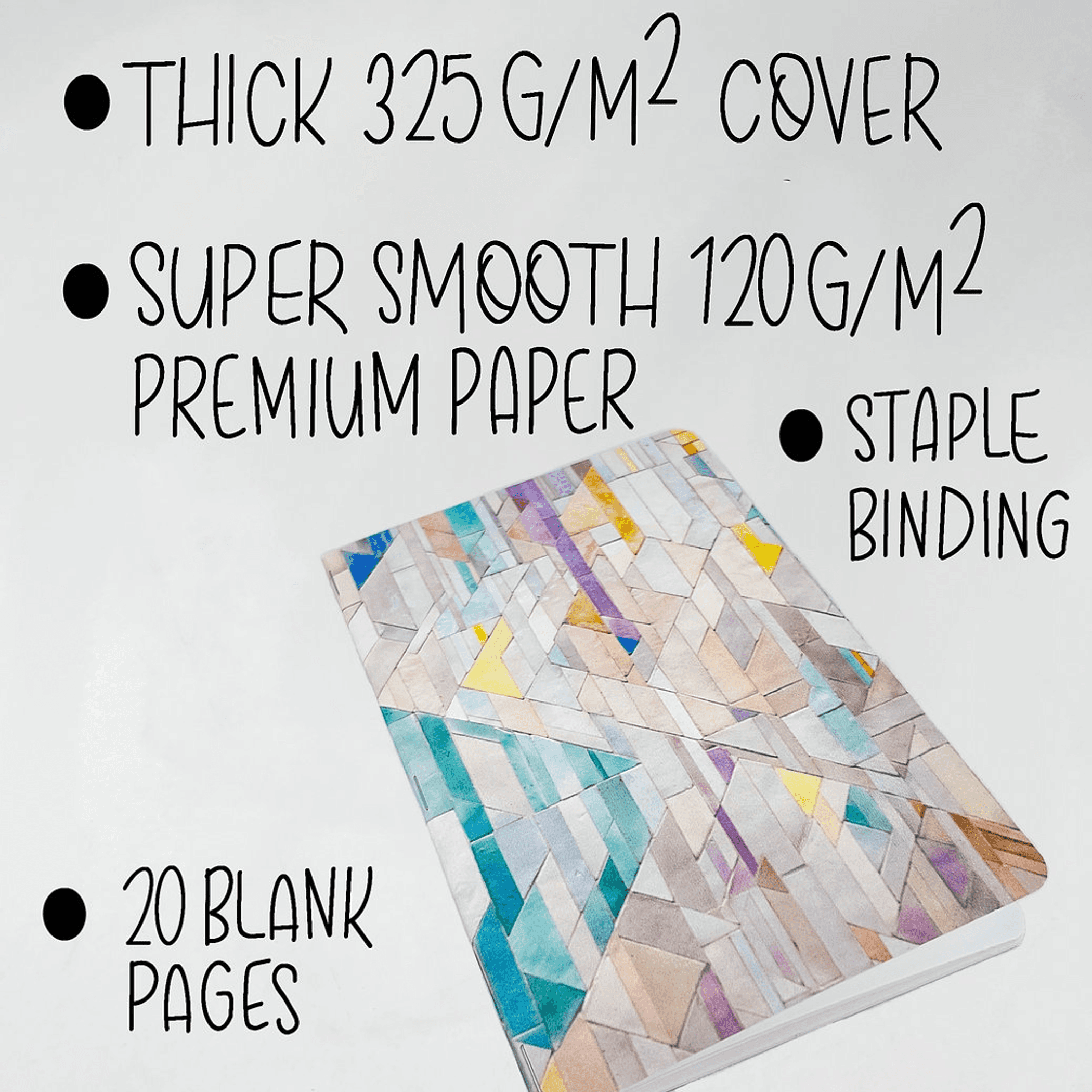 Handmade notebook with geometric tile cover, feature text label, and staple binding.