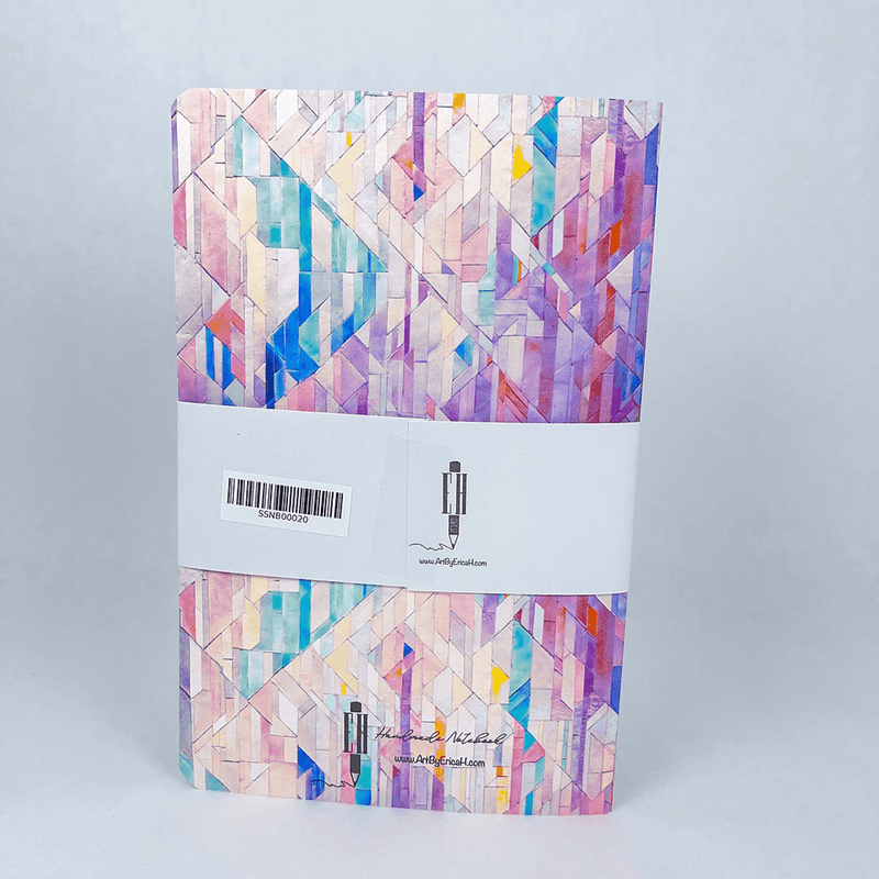 Handmade notebook with multicolor geometric tile cover and brand label on the back