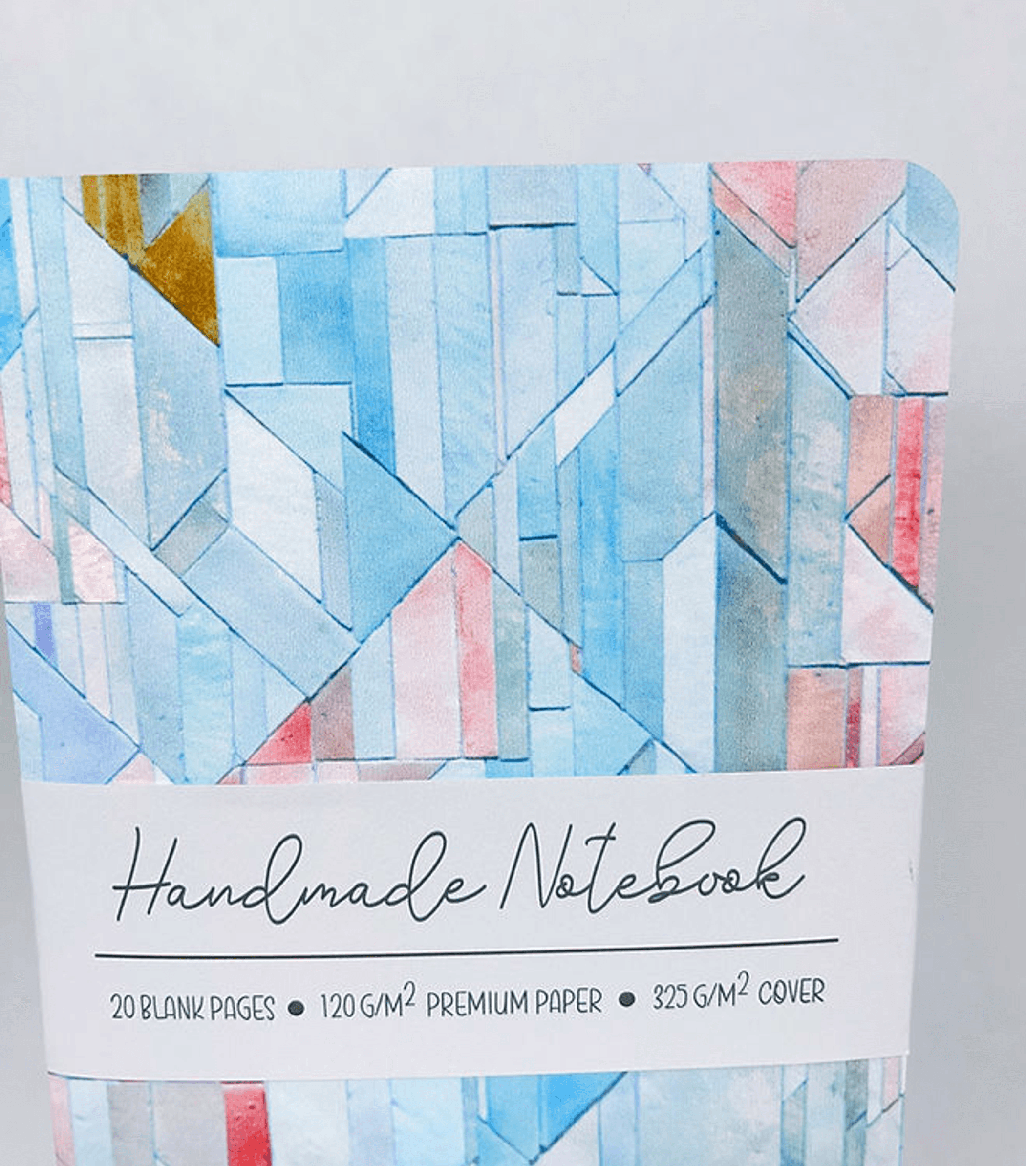 Geometric tiles notebook cover with blue, red, and gold accents