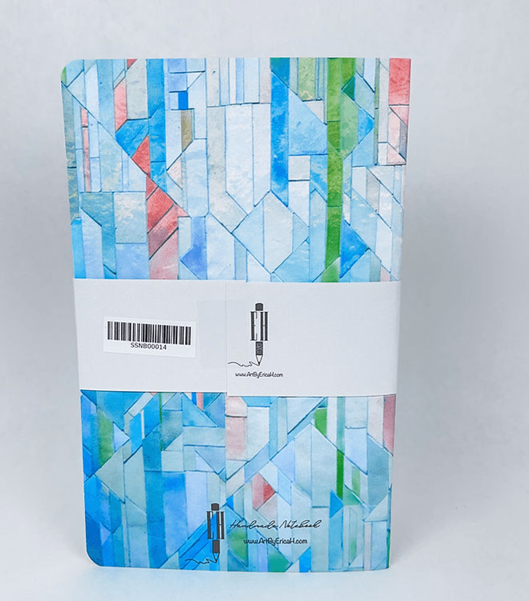 Geometric tiles A5-style notebook with multicolor blue and green cover