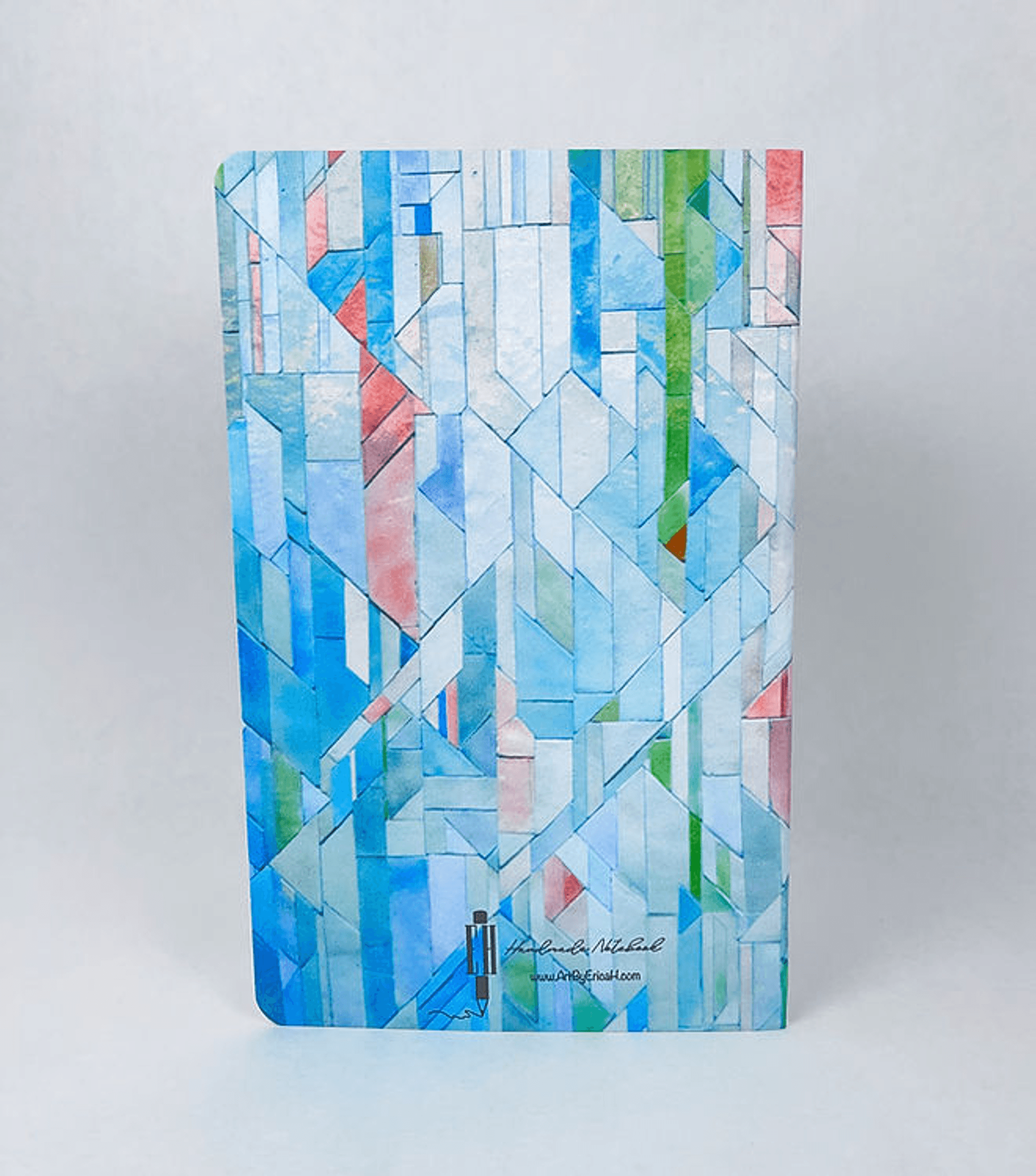 A5-style handmade notebook with blue geometric cover and green red accents