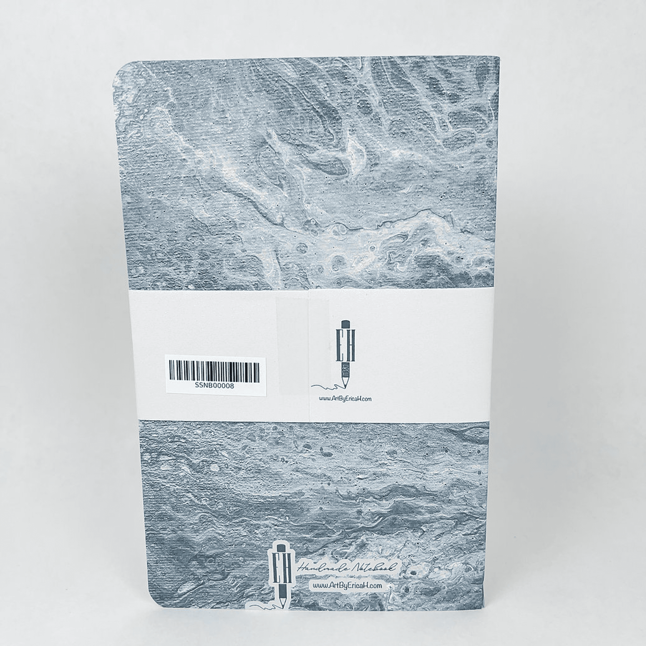 Blue marble notebook cover with barcode sticker and small brand logo