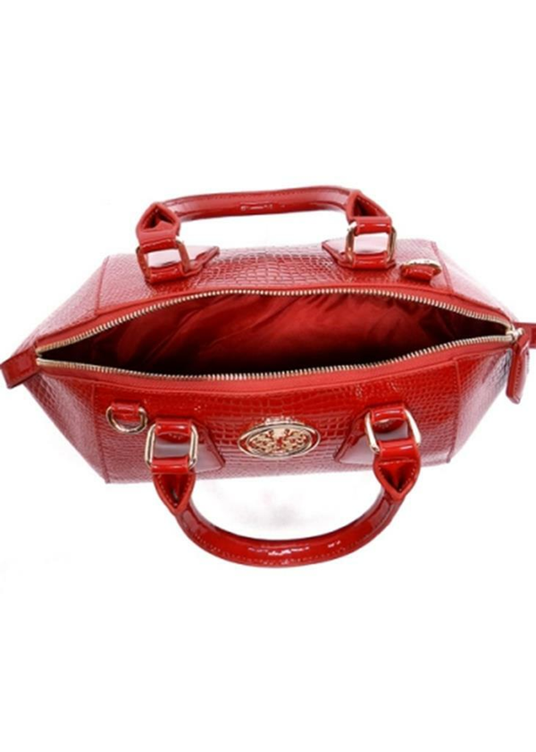 Burgundy textured handbag with top handles, zip closure, and front logo medallion