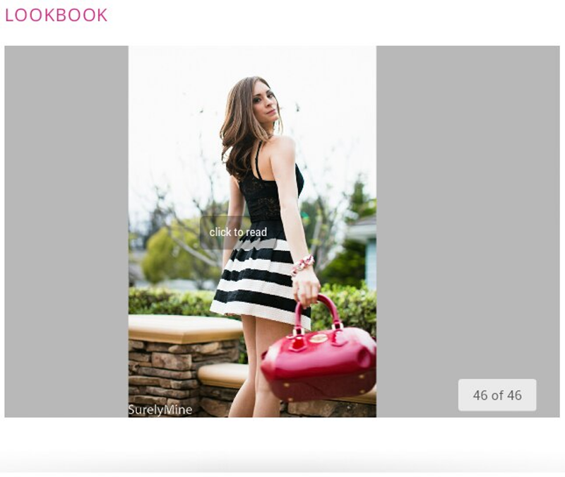 Burgundy handbag held in hand with top handles and textured finish