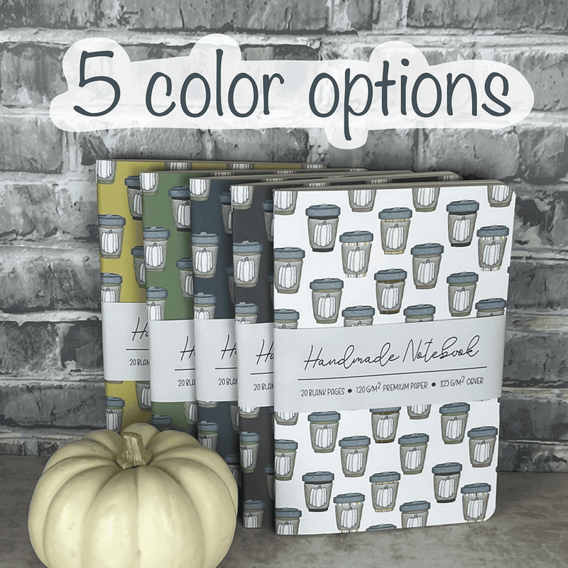 Set of staple-bound notebooks with pumpkin spice mug patterned covers in several shades