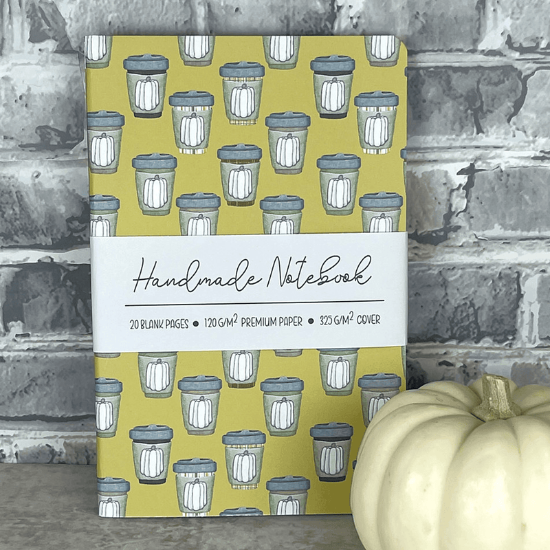 Mustard pumpkin spice pattern staple-bound notebook front cover with mug illustrations