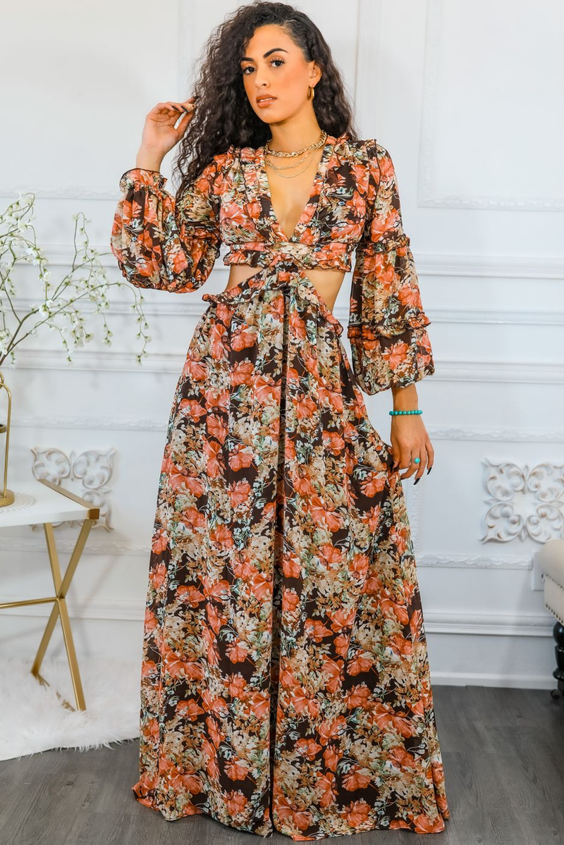 Floral maxi dress with V-neck and waist cut-out; gathered full skirt; orange floral pattern.