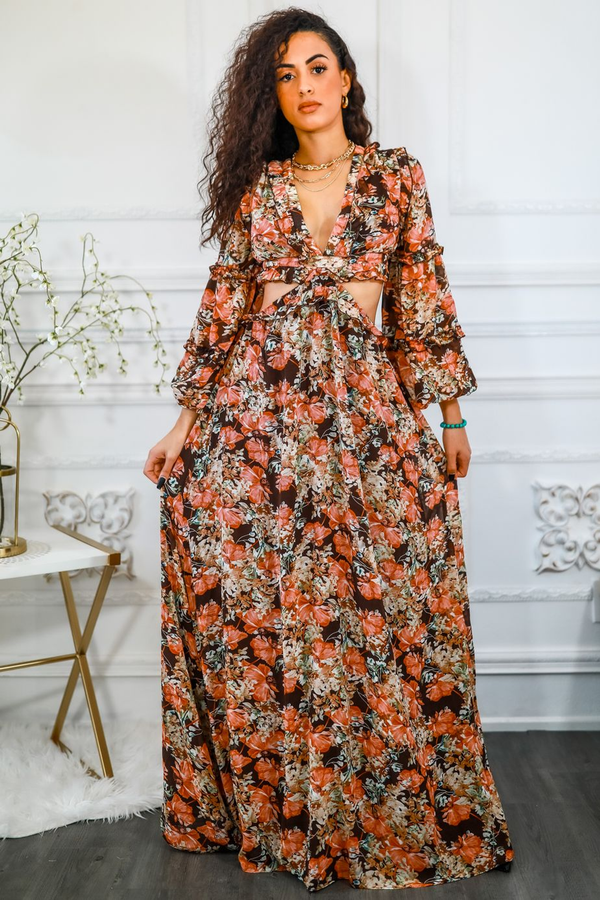 Floral maxi dress with V-neck, long sleeves, and waist cut-out; orange floral print.
