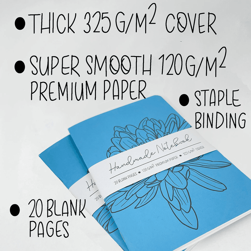 Stacked blue notebook covers with teal line flower design and staple binding