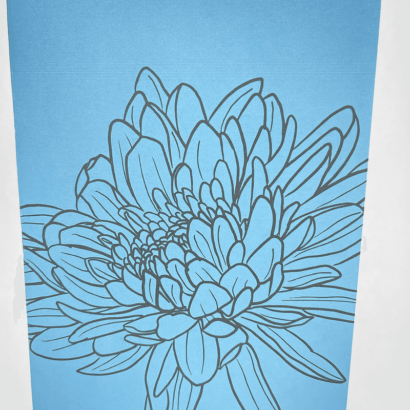 Blue notebook cover with close-up hand-drawn teal flower line art