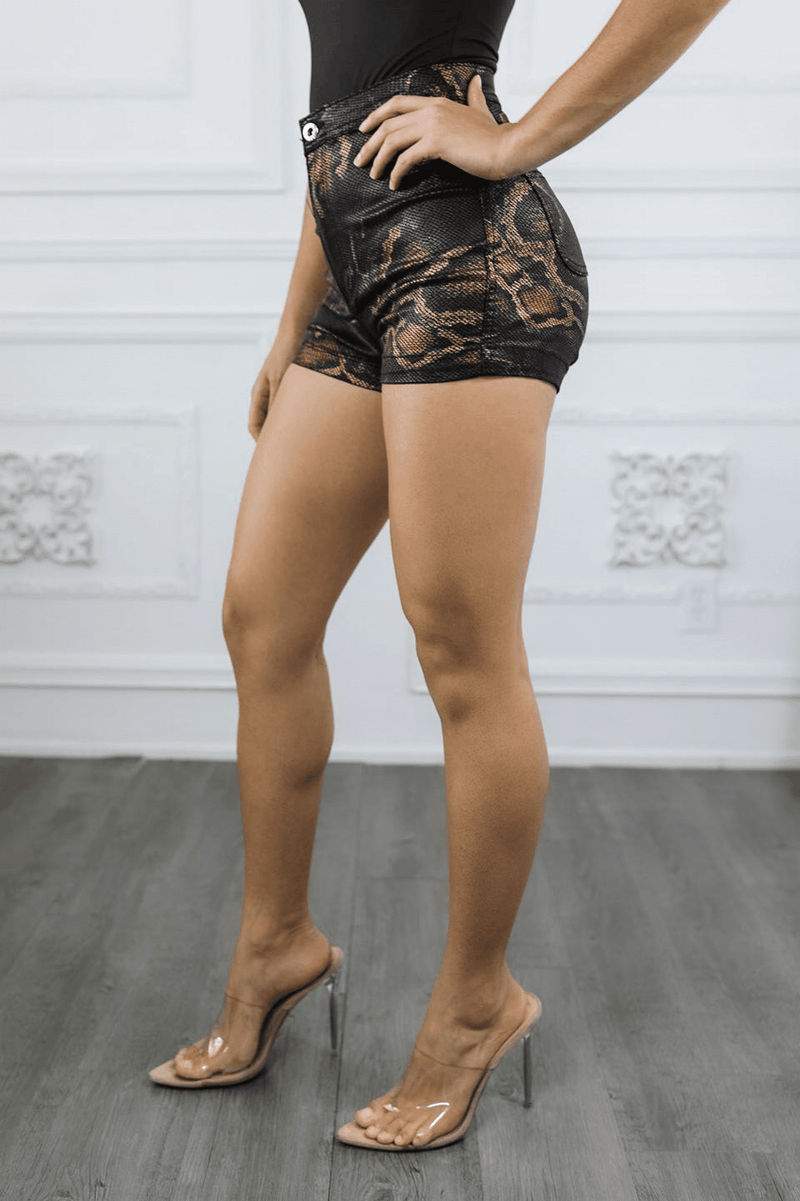 Coated snake-print short shorts in black with side pocket detail and button