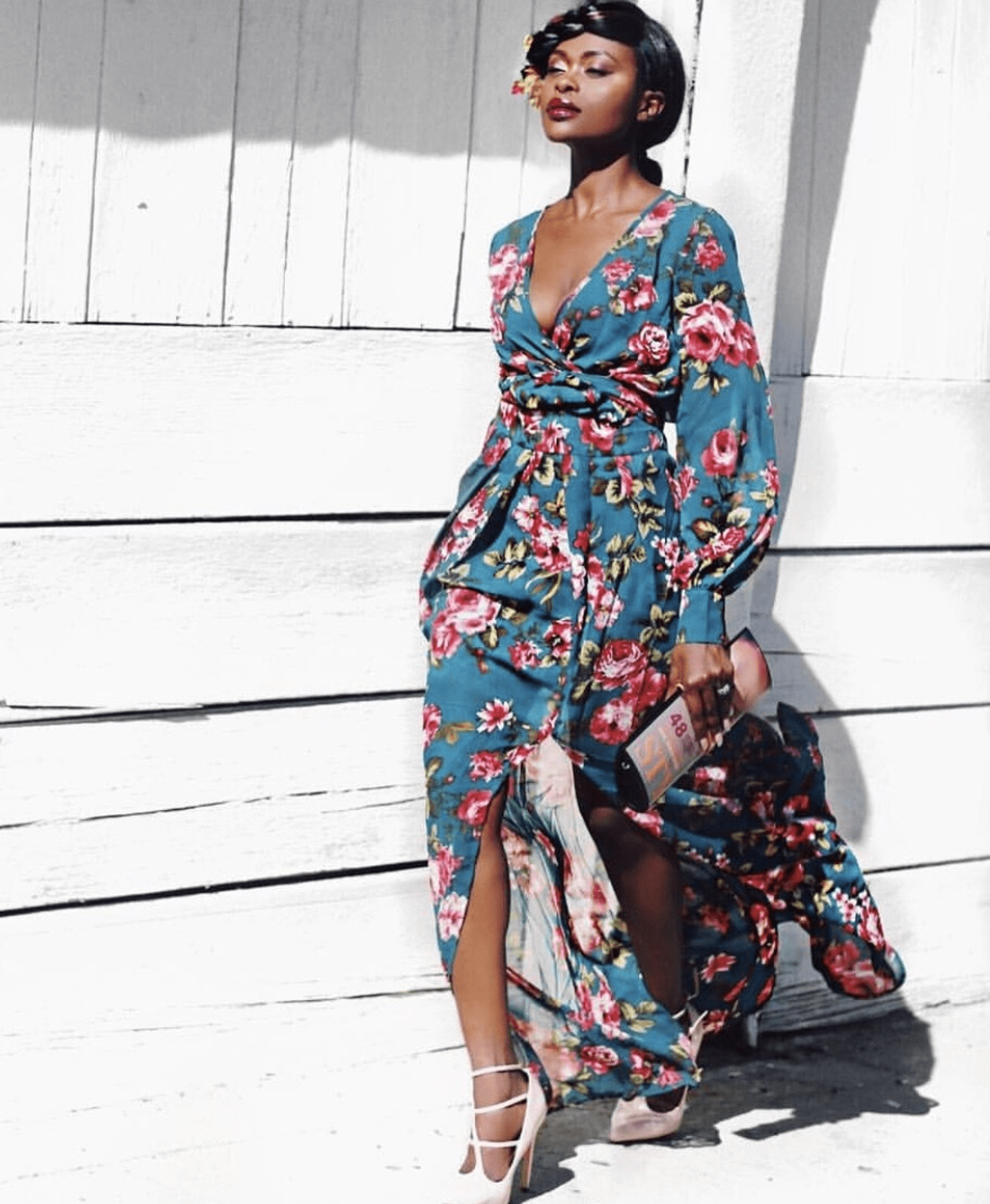 Two-piece floral maxi set with long sleeves, V-neck, tie waist, and side slit skirt