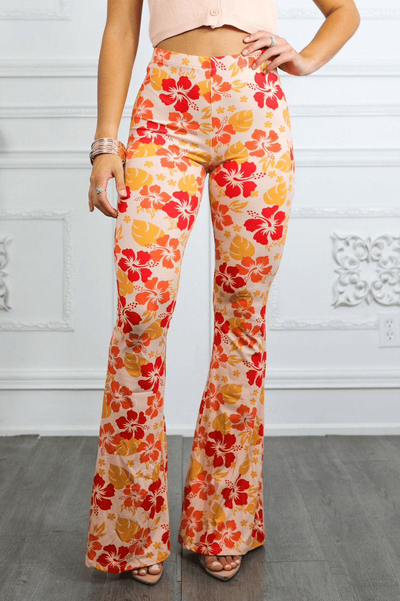 Women’s high-rise bell-bottom pants with orange-red floral print, flared legs